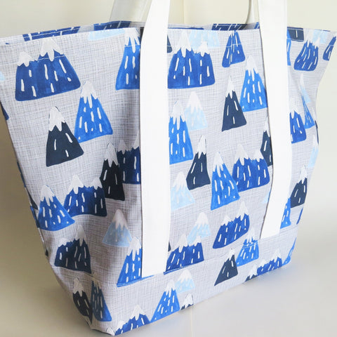 Snow-capped mountains tote bag