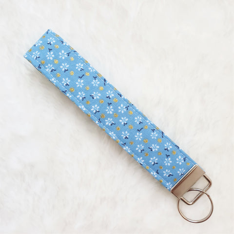 White flowers on blue with glitter dots Fabric Key Wristlet