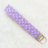 White flowers on purple with glitter dots Fabric Key Wristlet