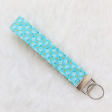 White flowers on Mint green with glitter dots Fabric Key Wristlet