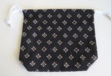Black and white block print cotton drawstring bag or knitting project bag.