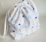 White floral print cotton drawstring bag or knitting project bag.