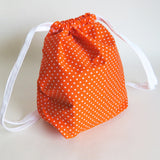 Orange and white polka dots print cotton drawstring bag or knitting project bag.