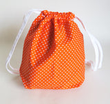 Orange and white polka dots print cotton drawstring bag or knitting project bag.