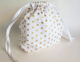 White and gold polka dot cotton drawstring bag or knitting project bag.