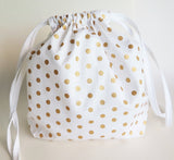 White and gold polka dot cotton drawstring bag or knitting project bag.