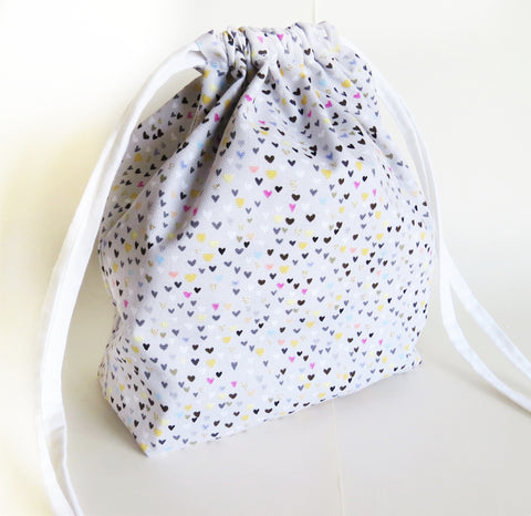 Gold, pink, teal hearts on grey cotton drawstring bag or knitting project bag.